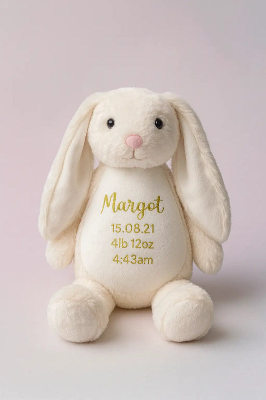 Cream-colored plush bunny with embroidered personalized birth weight gift.