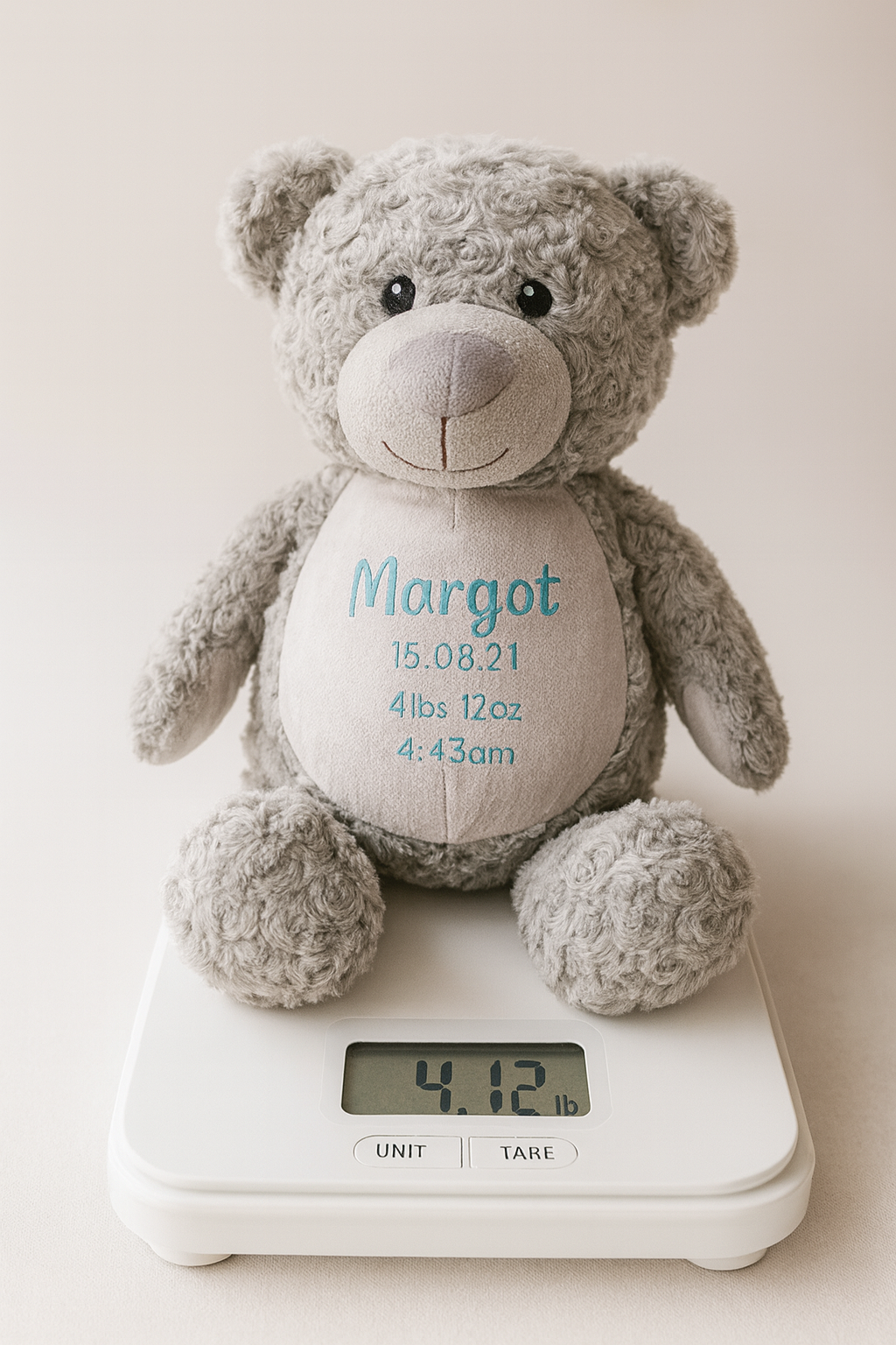 Gray birth weight teddy bear with embroidered name and details