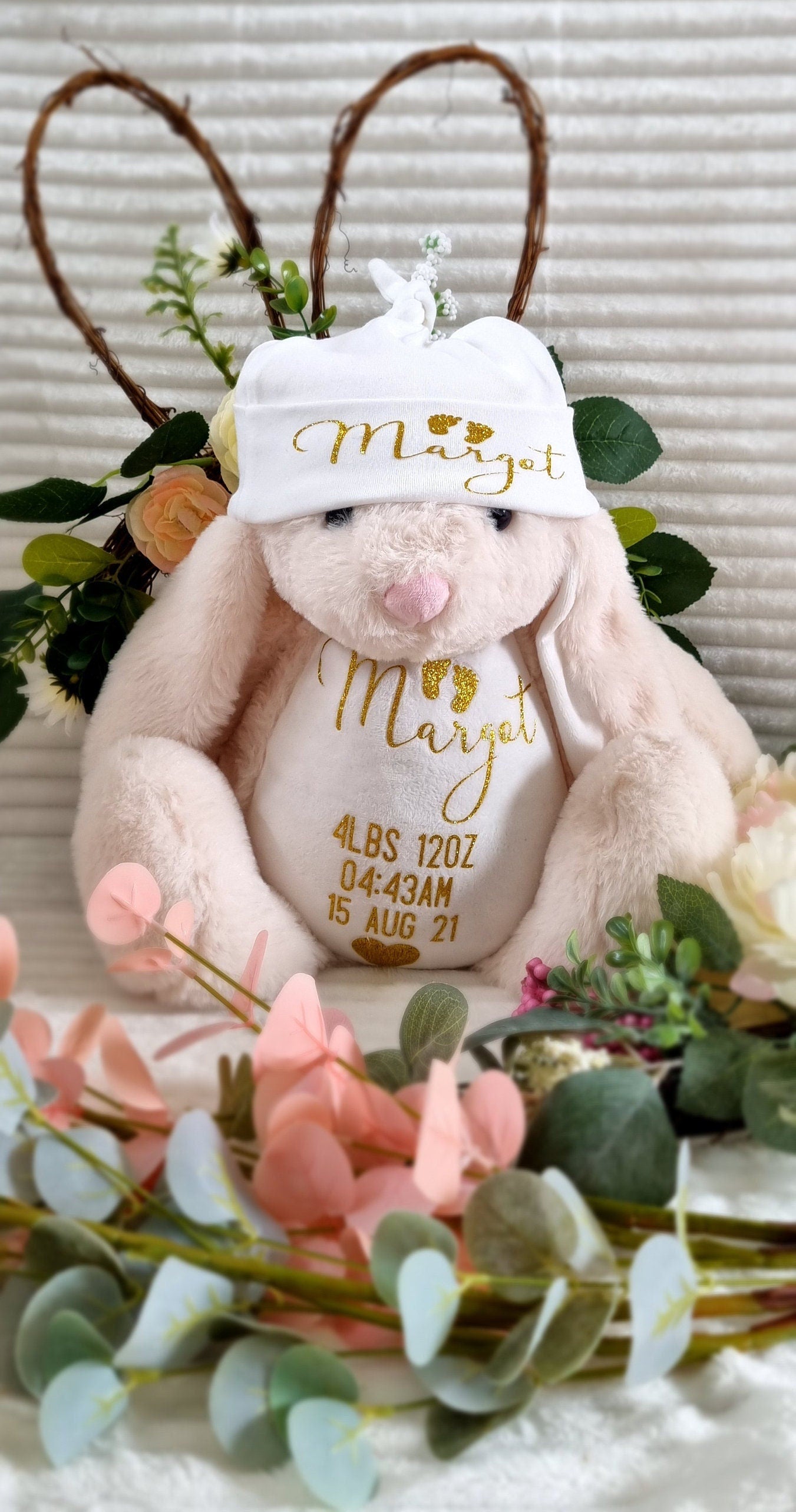 Golden Stitch cream bunny birth weight heirloom in pink plush with embroidered bib