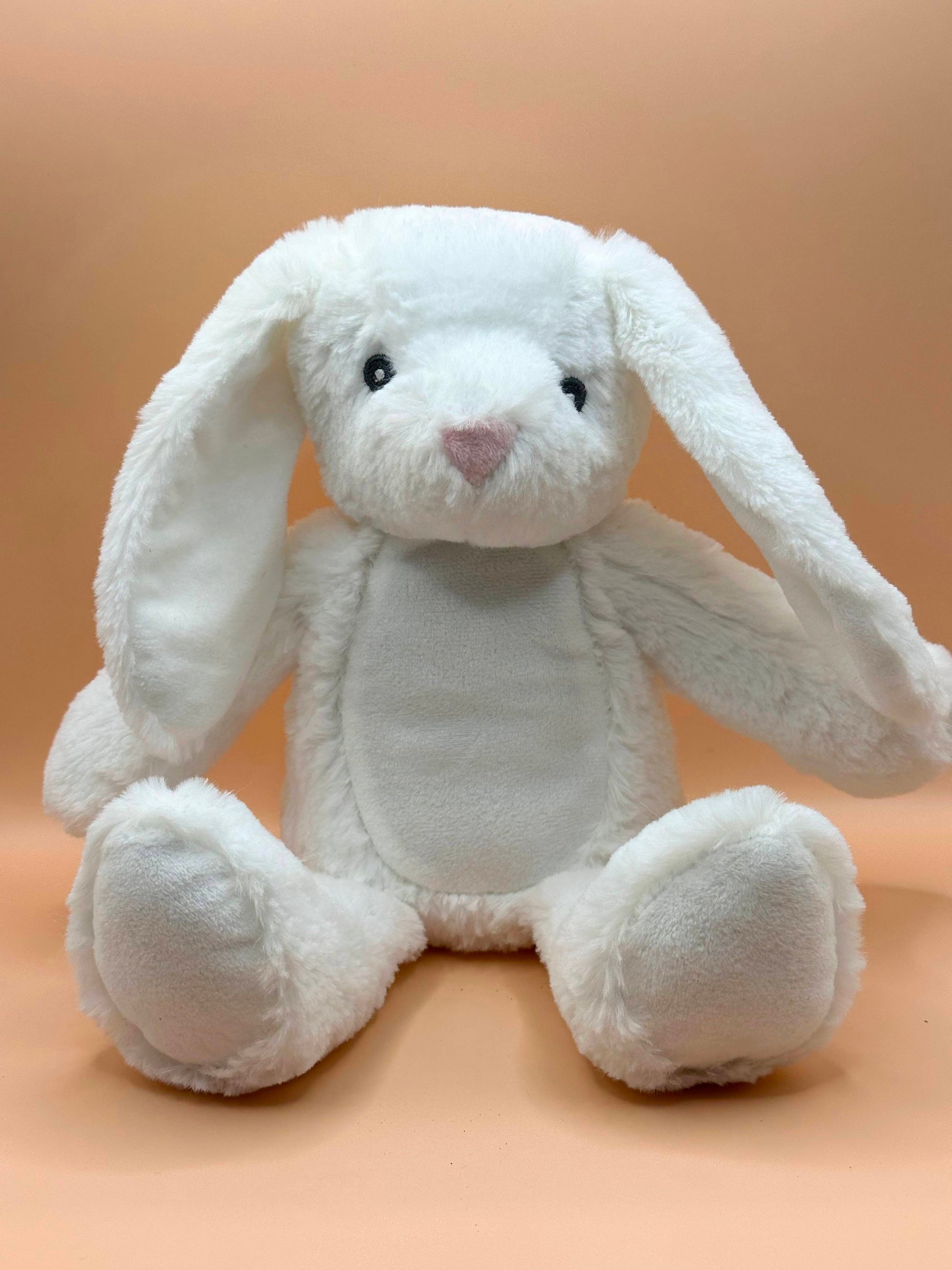 Plush white birth weight bunny with floppy ears and pink nose